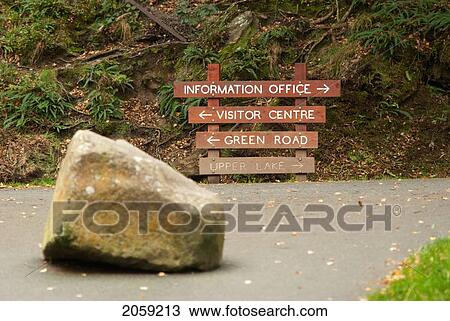 A Wooden Directional Sign For An Information Office And Visitor Centre; Ireland View Large Photo Image Stock Image - A Wooden Directional Sign For An Information Office And Visitor Centre; Ireland. Fotosearch
