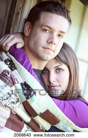 A Young Man And Young Woman Wrapped In A Blanket; Troutdale Oregon United States Of America View Large Photo Image Stock Image - A Young Man And Young Woman Wrapped In A Blanket; Troutdale Oregon United States Of America. Fotosearch