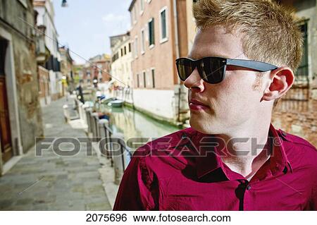A Young Man On The Street Beside A Canal; Venice Italy View Large Photo Image Stock Photograph - A Young Man On The Street Beside A Canal; Venice Italy. Fotosearch