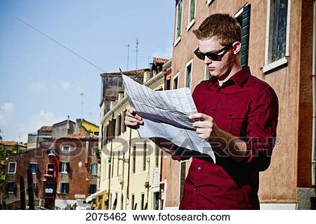 A Young Man Stands Reading A Map; Venice Italy View Large Photo Image Stock Image - A Young Man Stands Reading A Map; Venice Italy. Fotosearch