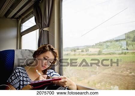A Young Woman Riding In A Train; Italy View Large Photo Image Stock Image - A Young Woman Riding In A Train; Italy. Fotosearch