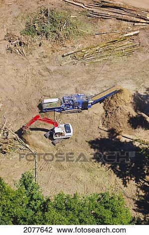 Stock Image - Aerial view of heavy equipment clearing land for development; portland oregon united states of america. Fotosearch