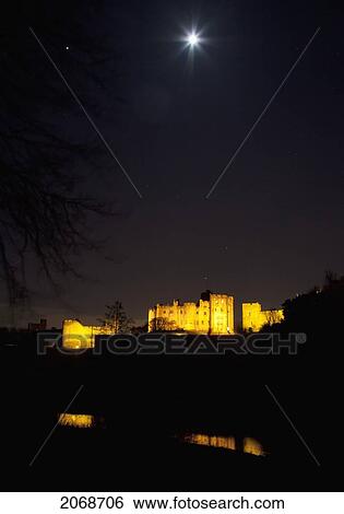 Alnwick Castle Illuminated At Night With The Moon Shining In The Sky; Alnwick Northumberland England View Large Photo Image Stock Photograph - Alnwick Castle Illuminated At Night With The Moon Shining In The Sky; Alnwick Northumberland England. Fotosearch