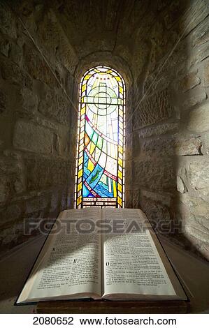 An open bible and a stained glass window in st. mary's church; holystone northumberland england View Large Photo Image Stock Image - An open bible and a stained glass window in st. mary's church; holystone northumberland england. Fotosearch