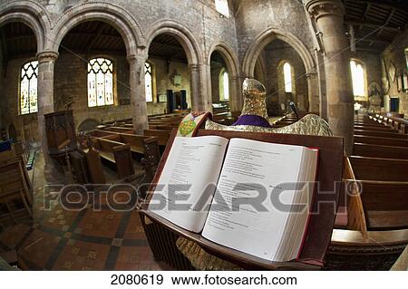 Stock Photo - An open book of verses in a church; staindrop durham england. Fotosearch