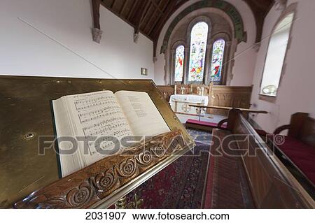 Stock Photo - An Open Hymnal On A Stand Inside A Church; Northumberland England. Fotosearch