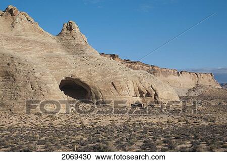 An Opening In The Rock Cliff Against A Bright Blue Sky In Glen Canyon National Recreation Area; Utah United States Of America View Large Photo Image Stock Image - An Opening In The Rock Cliff Against A Bright Blue Sky In Glen Canyon National Recreation Area; Utah United States Of America. Fotosearch