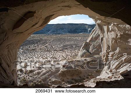 An Opening In The Rock Cliff With A View Across The Landscape In Glen Canyon National Recreation Area; Utah United States Of America View Large Photo Image Stock Image - An Opening In The Rock Cliff With A View Across The Landscape In Glen Canyon National Recreation Area; Utah United States Of America. Fotosearch