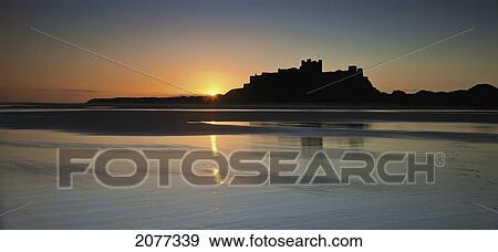 Stock Photo - Bamburgh castle at sunset; bamburgh northumberland england. Fotosearch