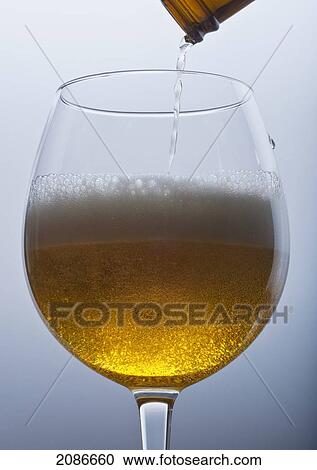 Beer being poured into a glass; tarifa cadiz andalusia spain View Large Photo Image Stock Image - Beer being poured into a glass; tarifa cadiz andalusia spain. Fotosearch