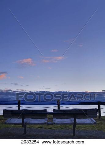 Picture - Bench Seat Overlooking Lake Taupo; Taupo New Zealand. Fotosearch