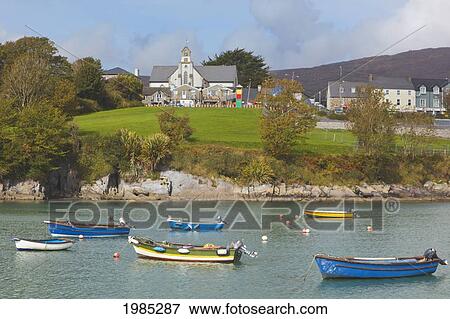 Stock Photo - Boats In The Harbour And Buildings In The Town; Schull County Cork Ireland. Fotosearch
