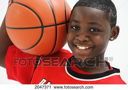 Boy In Red Jersey Holding A Basketball; Portland Oregon United States Of America View Large Photo Image Stock Image - Boy In Red Jersey Holding A Basketball; Portland Oregon United States Of America. Fotosearch