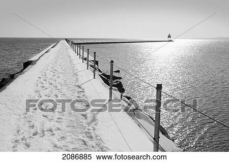 Breakwater wall with a lighthouse at the end; two harbors minnesota united states of america View Large Photo Image Stock Photography - Breakwater wall with a lighthouse at the end; two harbors minnesota united states of america. Fotosearch