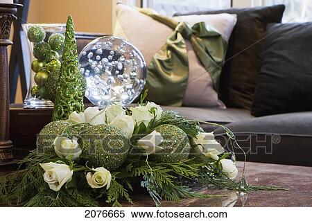 Close up of christmas decorations green baubles with white roses and pillows in the background; calgary alberta canada View Large Photo Image Stock Photography - Close up of christmas decorations green baubles with white roses and pillows in the background; calgary alberta canada. Fotosearch