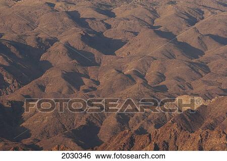 Stock Photograph - Close Up Of Desert Mountain Hillside Face At Sunrise; Palm Springs California United States Of America. Fotosearch