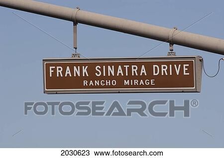 Close Up Of Frank Sinatra Drive Road Sign Against A Blue Sky; Rancho Mirage California United States Of America View Large Photo Image Stock Image - Close Up Of Frank Sinatra Drive Road Sign Against A Blue Sky; Rancho Mirage California United States Of America. Fotosearch