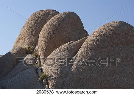 Close Up Of Rounded Rocks And Blue Sky; Palm Springs California United States Of America View Large Photo Image Stock Photo - Close Up Of Rounded Rocks And Blue Sky; Palm Springs California United States Of America. Fotosearch