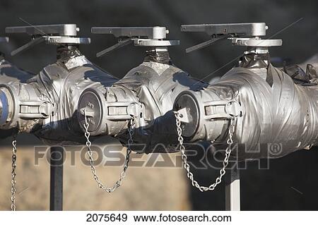 Stock Photo - Close Up Of Valves; Alberta Canada. Fotosearch