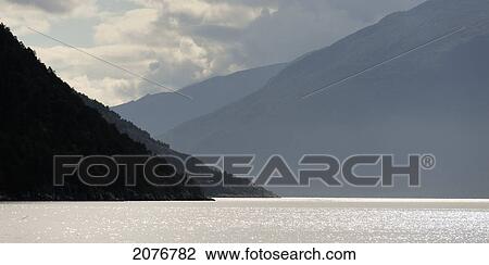 Cloud and mountains along the water's edge; sogn og fjordane norway View Large Photo Image Stock Image - Cloud and mountains along the water's edge; sogn og fjordane norway. Fotosearch