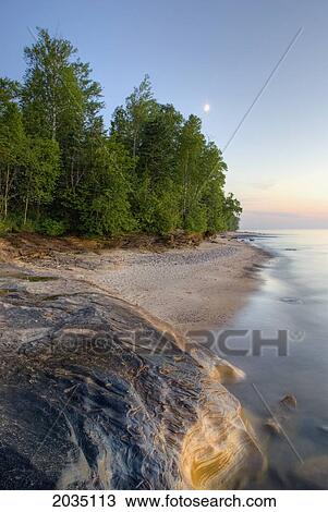 Colorful Rock On A Beach At Sunset; Michigan United States Of America View Large Photo Image Stock Image - Colorful Rock On A Beach At Sunset; Michigan United States Of America. Fotosearch