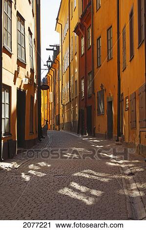 Colourful buildings along a narrow street; stockholm sweden View Large Photo Image Stock Image - Colourful buildings along a narrow street; stockholm sweden. Fotosearch