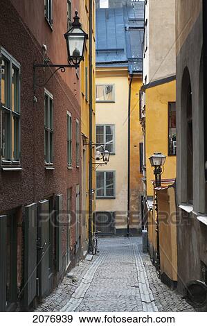 Colourful buildings along a narrow alley in old town; stockholm sweden View Large Photo Image Stock Photo - Colourful buildings along a narrow alley in old town; stockholm sweden. Fotosearch