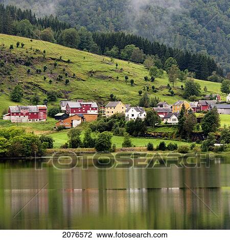 Colourful houses on a hill along the water; granvin hordaland norway View Large Photo Image Stock Image - Colourful houses on a hill along the water; granvin hordaland norway. Fotosearch
