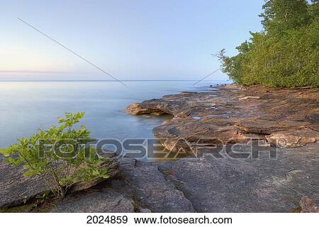 Colourful Rocky Beach At Sunset; Michigan United States Of America View Large Photo Image Stock Photo - Colourful Rocky Beach At Sunset; Michigan United States Of America. Fotosearch