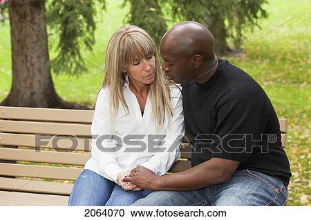 Couple Praying Together In A Park Bench; Edmonton Alberta Canada View Large Photo Image Stock Image - Couple Praying Together In A Park Bench; Edmonton Alberta Canada. Fotosearch