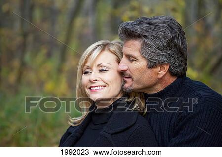Couple Spending Quality Time Together In A Park In Autumn; St. Albert Alberta Canada View Large Photo Image Stock Image - Couple Spending Quality Time Together In A Park In Autumn; St. Albert Alberta Canada. Fotosearch