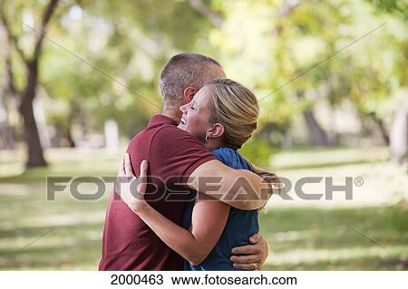 Stock Image - Couple Spending Quality Time Together In A Park In Autumn; Edmonton Alberta Canada. Fotosearch