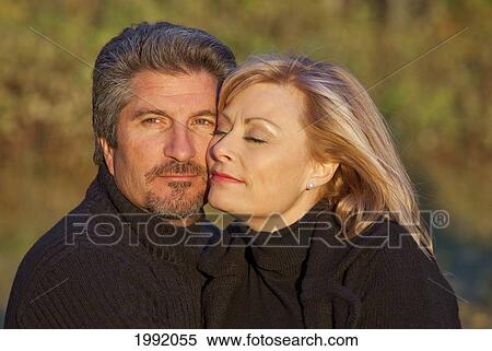 Stock Photography - Couple Spending Quality Time Together In A Park In Autumn; St. Albert Alberta Canada. Fotosearch