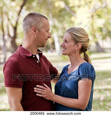 Stock Photography - Couple Spending Quality Time Together In A Park In Autumn; Edmonton Alberta Canada. Fotosearch