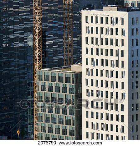 Cranes beside tall buildings; oslo norway View Large Photo Image Stock Image - Cranes beside tall buildings; oslo norway. Fotosearch