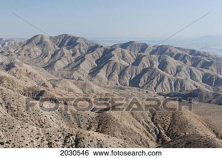 Desert Mountain Range With Eroded Contours And Blue Sky; Palm Springs California United States Of America View Large Photo Image Stock Photograph - Desert Mountain Range With Eroded Contours And Blue Sky; Palm Springs California United States Of America. Fotosearch