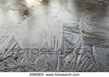 Picture - Detailed pattern of ice on the water's frozen surface; thunder bay ontario canada. Fotosearch