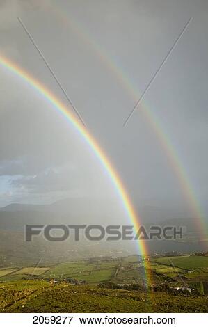 Double Rainbow Over Farmland At Derrynane Harbour Near Caherdaniel; County Kerry Ireland View Large Photo Image Stock Photo - Double Rainbow Over Farmland At Derrynane Harbour Near Caherdaniel; County Kerry Ireland. Fotosearch