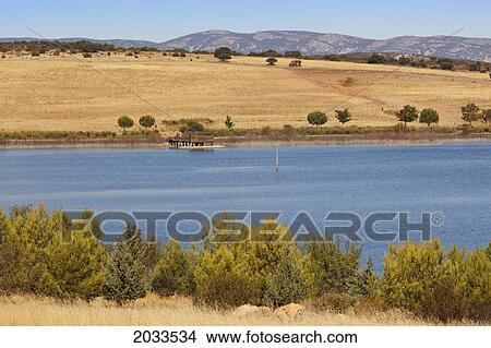 Picture - El Vicario Dam On The Guadiana River Near Peralvillo; Ciudad Real Province Castilla-La Mancha Spain. Fotosearch