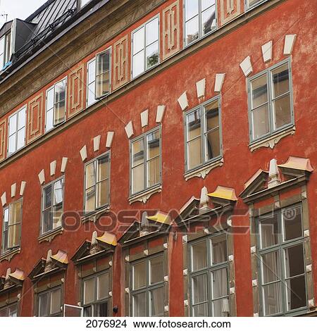 Facade of a red building in old town; stockholm sweden View Large Photo Image Picture - Facade of a red building in old town; stockholm sweden. Fotosearch