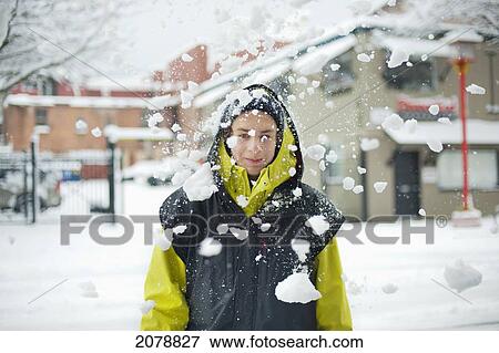 Falling chunks of snow in front of a person; victoria british columbia canada View Large Photo Image Stock Photo - Falling chunks of snow in front of a person; victoria british columbia canada. Fotosearch