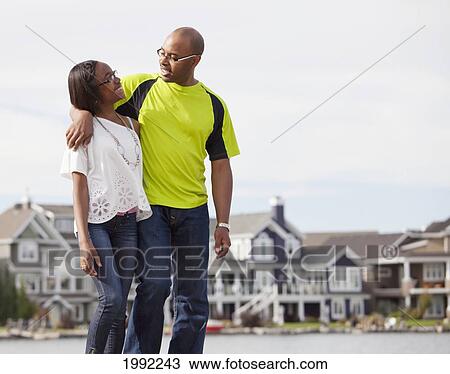 Father And Daughter Walking And Talking On A Pier In A Residential Lake Area; Edmonton Alberta Canada View Large Photo Image Stock Image - Father And Daughter Walking And Talking On A Pier In A Residential Lake Area; Edmonton Alberta Canada. Fotosearch