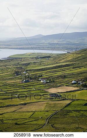 Fields And Farms Along The Coast Near Waterville; County Kerry Ireland View Large Photo Image Stock Photo - Fields And Farms Along The Coast Near Waterville; County Kerry Ireland. Fotosearch