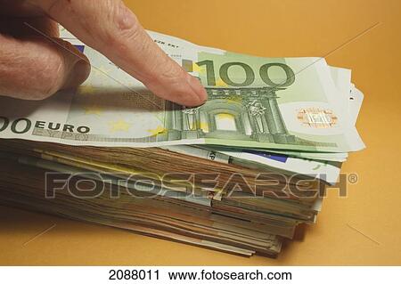 Finger pressing down on top of big pile of euro notes; spain View Large Photo Image Stock Image - Finger pressing down on top of big pile of euro notes; spain. Fotosearch