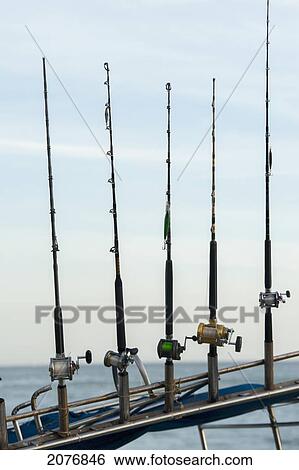 Five fishing poles in a row; sayulita mexico View Large Photo Image Stock Photograph - Five fishing poles in a row; sayulita mexico. Fotosearch