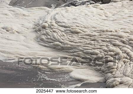 Stock Photo - Foam Forms On The Surface Of The Water At Chesterman's Beach Near Tofino; British Columbia Canada. Fotosearch