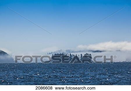Stock Photo - Fog surrounds the islands in broken island group on the west coast of vancouver island; british columbia canada. Fotosearch