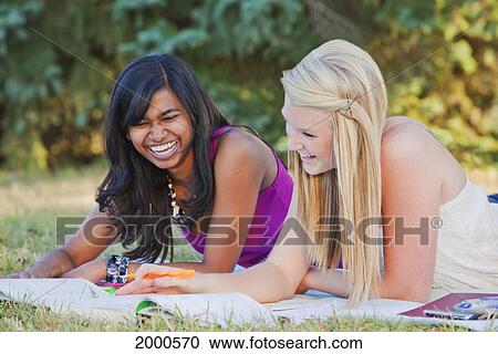 Friends Doing Homework Together In A Park; Edmonton Alberta Canada View Large Photo Image Stock Image - Friends Doing Homework Together In A Park; Edmonton Alberta Canada. Fotosearch