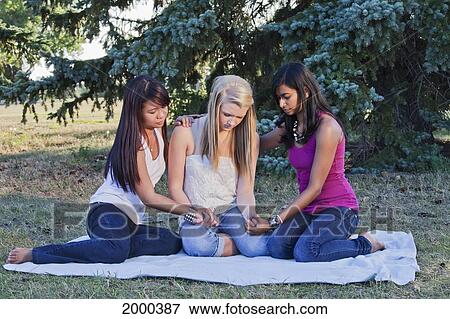Stock Photo - Friends Holding Hands And Praying Together; Edmonton Alberta Canada. Fotosearch