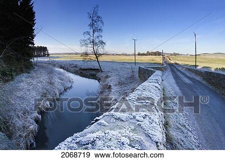 Frost On A Stone Wall Along A Rural Road And Stream; Northumberland England View Large Photo Image Stock Photo - Frost On A Stone Wall Along A Rural Road And Stream; Northumberland England. Fotosearch